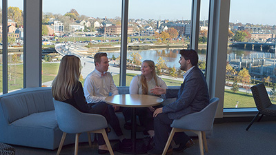 four people sitting at a table